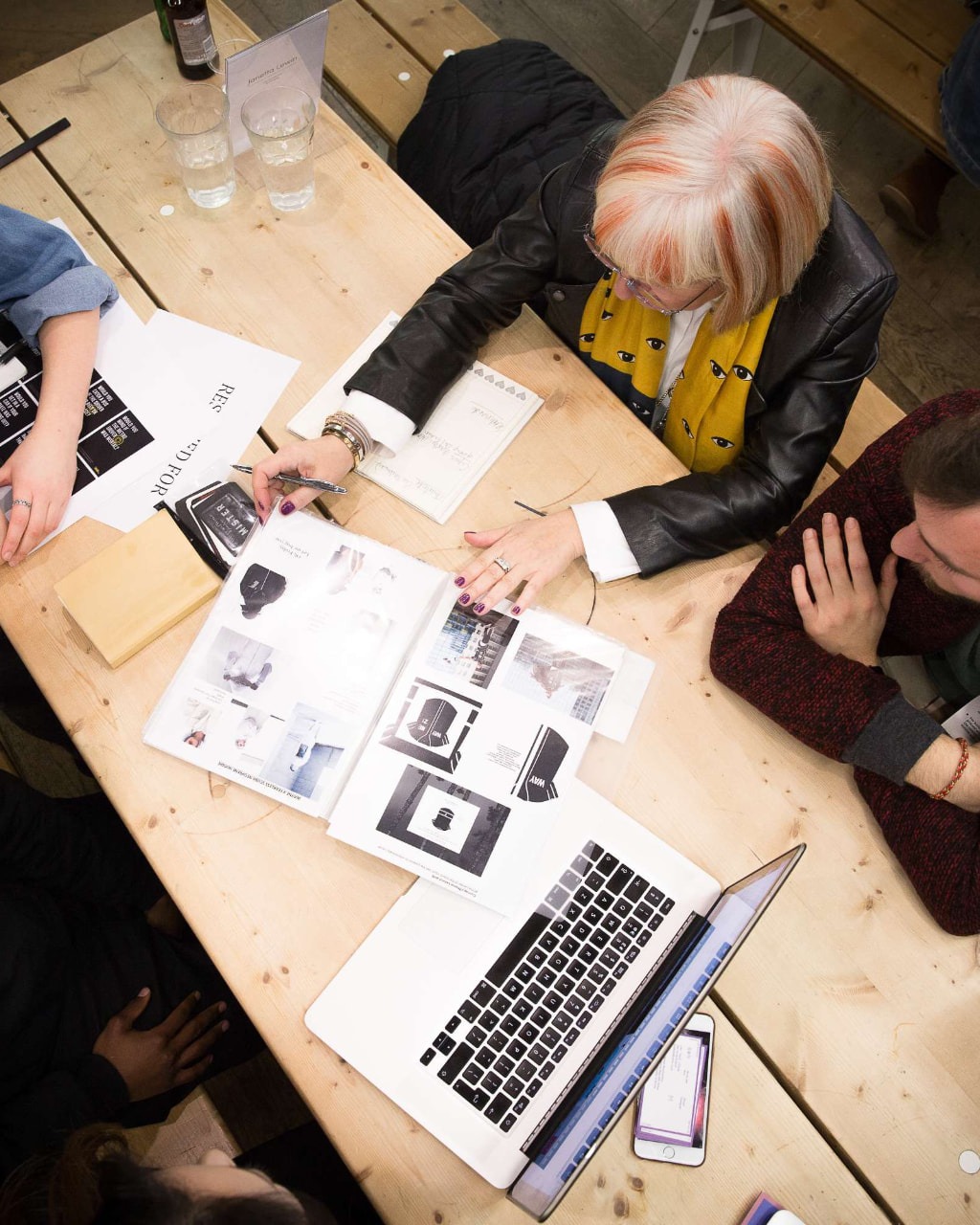 The Dots — portfolio review around the workshop table